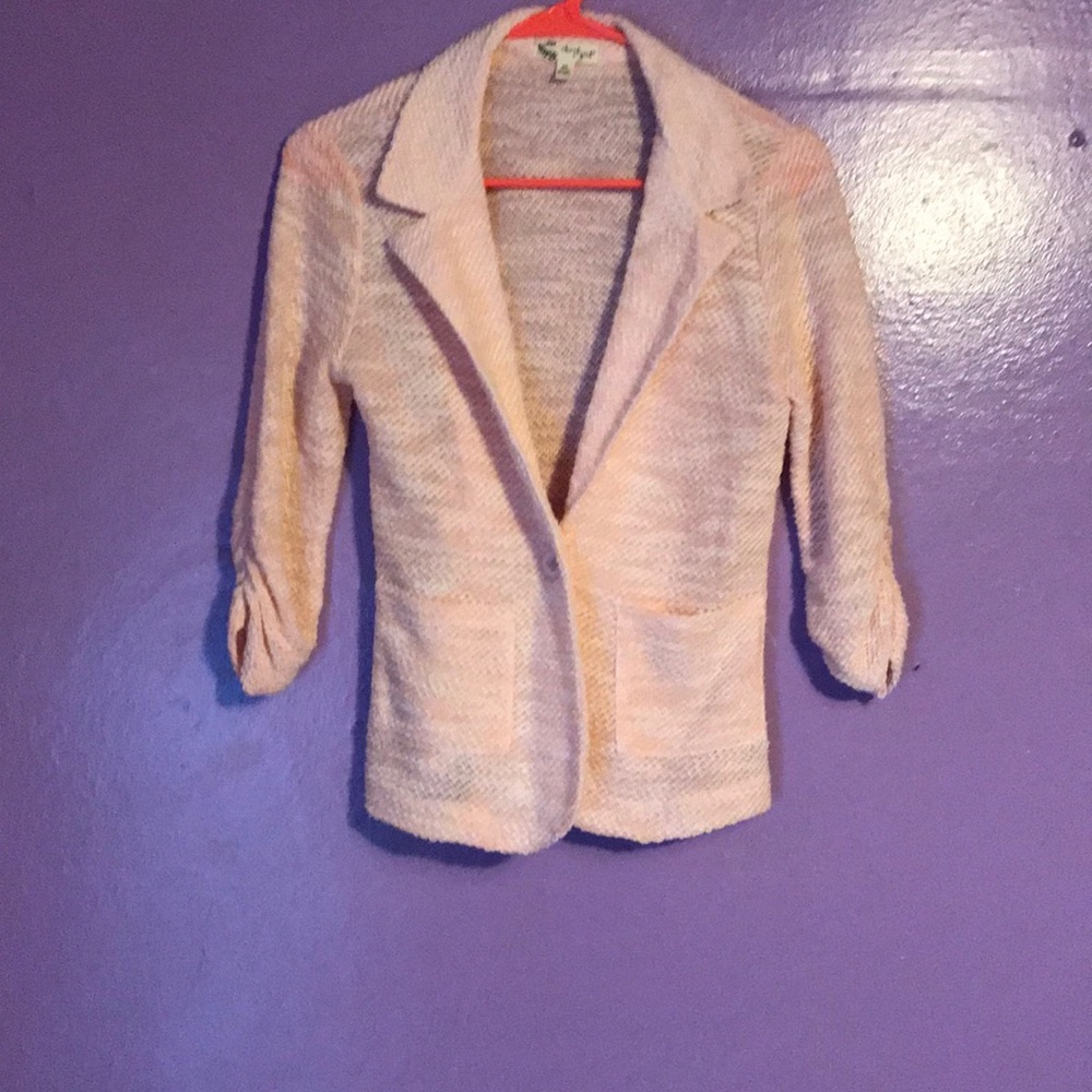 Light pink knit blazer.